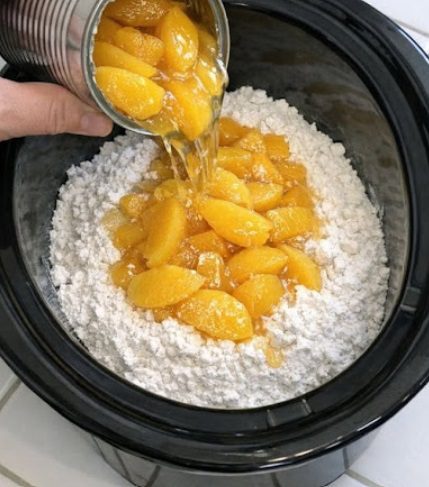 Dump cheap canned peaches over dry cake mix, together with 2 other ingredients, into slow cooker for a comforting bowl that disappears faster than any