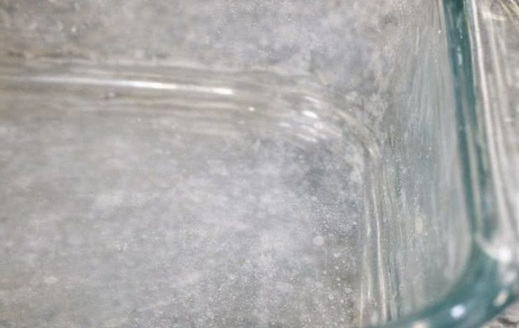 My glass baking dishes have a cloudy white haze that won’t wash off — what is it?