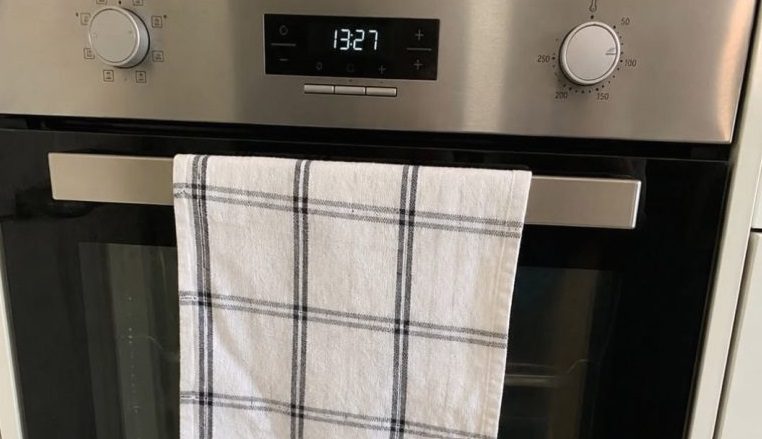 The Hidden Kitchen Hazard: Why That Tea Towel on the Oven Door is a Recipe for…