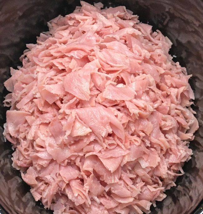 Toss a pile of shaved deli ham in the slow cooker with 3 other ingredients and get a meal so delicious your family will be begging for more.