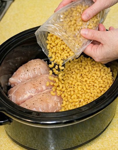 Dump dry elbow macaroni beside raw chicken breasts, together with 3 ingredients, into slow cooker for a nostalgic feast that’s my default when I don’t