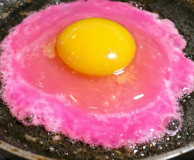 I cracked an egg and the liquid is a neon pearlescent pink — is this safe?